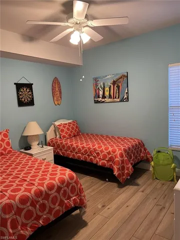 a bedroom with bed and a window