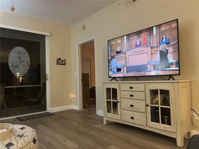 a view of a dresser with wooden floor