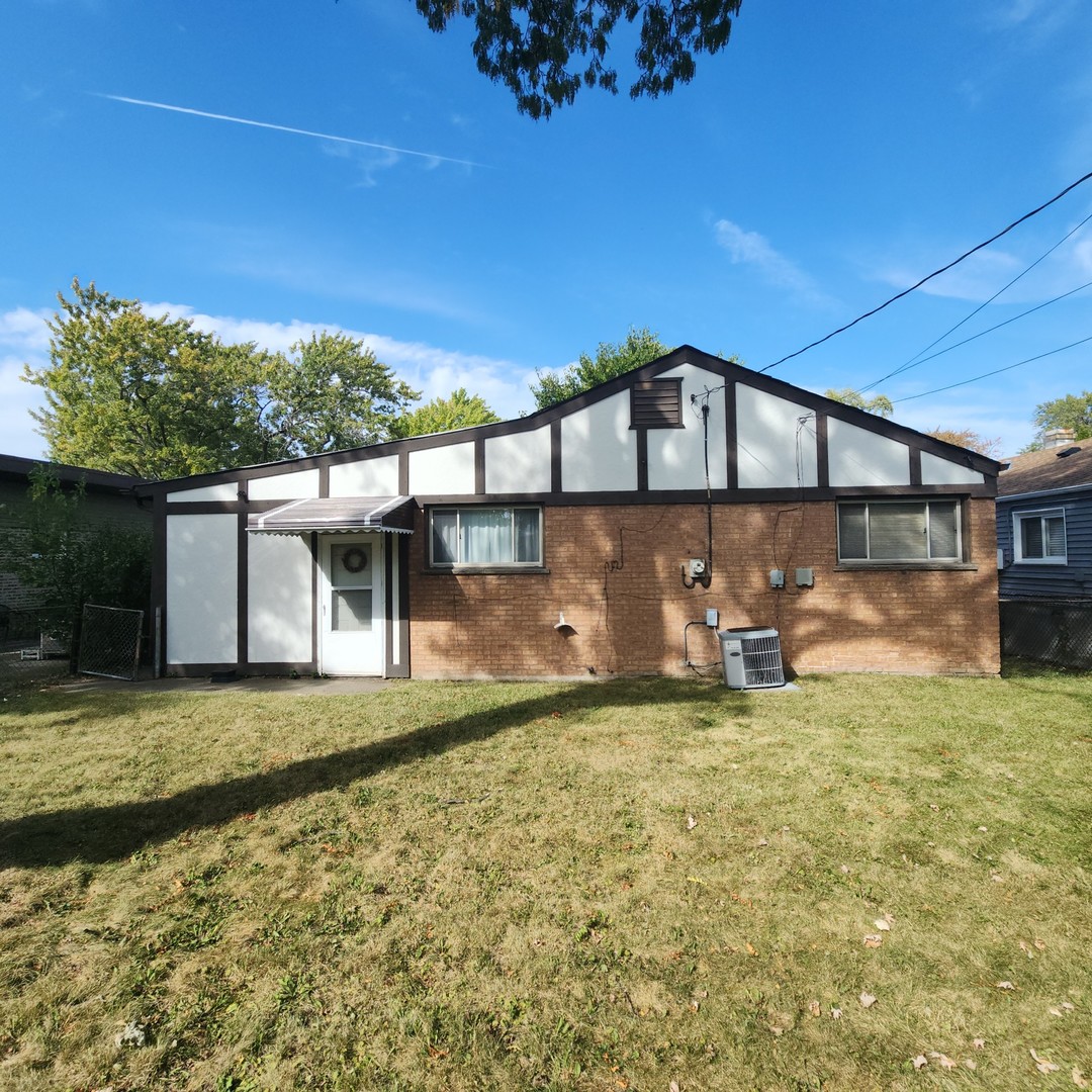 4605 West 84th Place Chicago, IL 60652 - Photo 21 of 30 a view of a house with a yard