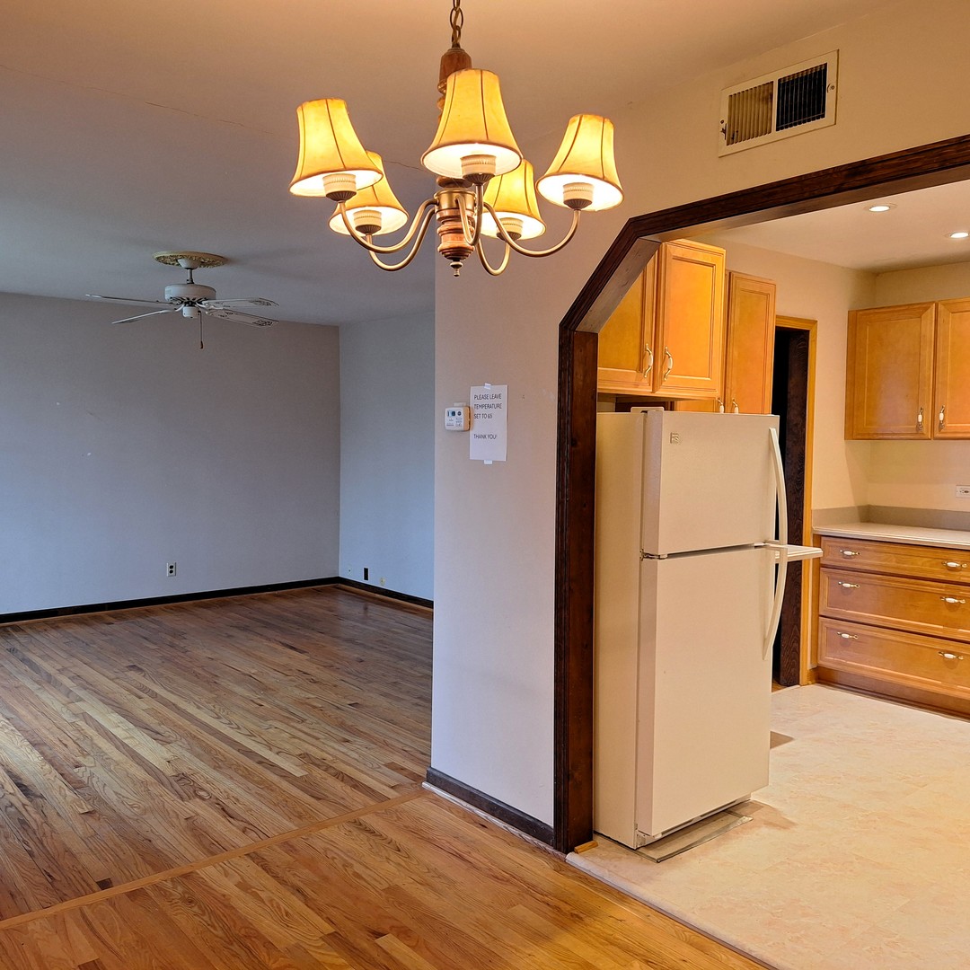 4605 West 84th Place Chicago, IL 60652 - Photo 8 of 30 a view of a livingroom with wooden floor