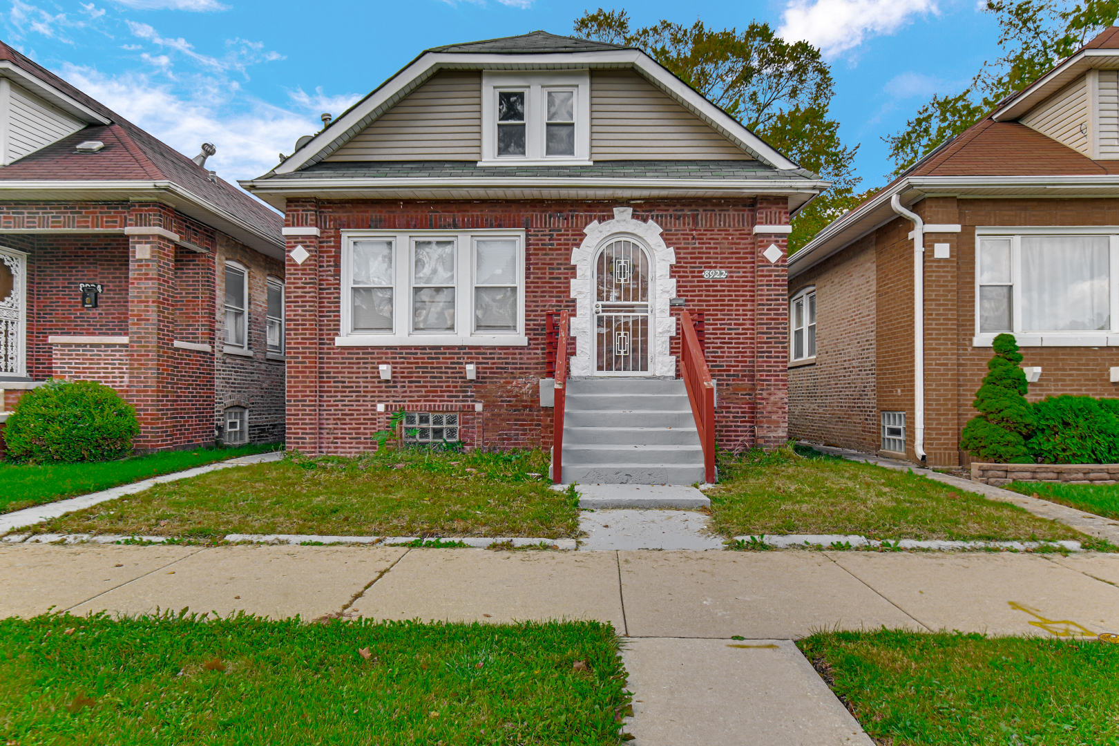 8922 South May Street Chicago, IL 60620 - Photo 2 of 23 a front view of a house with a yard and outdoor space