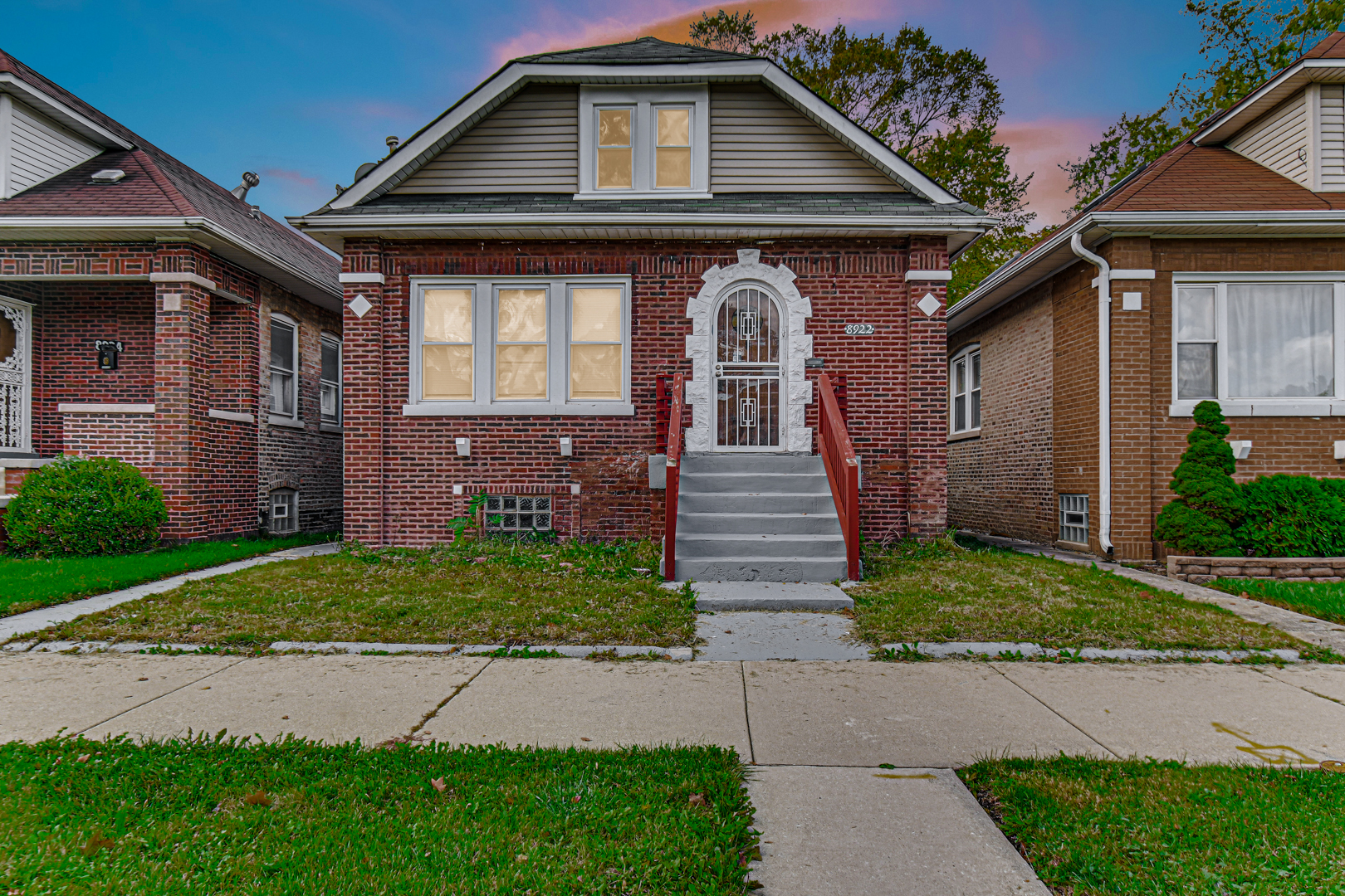 8922 South May Street Chicago, IL 60620 - Photo 3 of 23 a front view of a house with garden