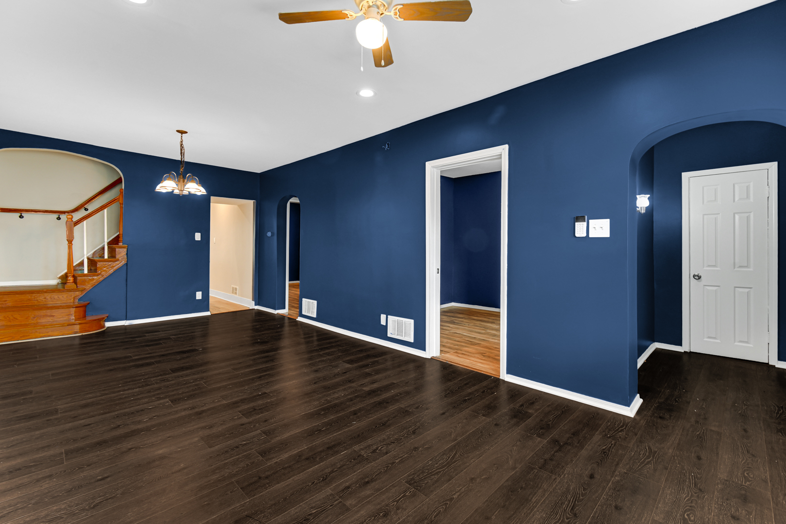 8922 South May Street Chicago, IL 60620 - Photo 7 of 23 a view of an empty room with wooden floor