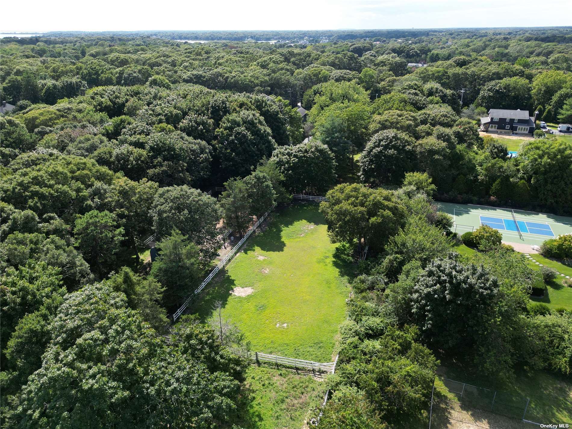 190 A South Country Road Remsenburg, NY 11960 - Photo 5 of 8 an aerial view of a residential houses with yard and swimming pool