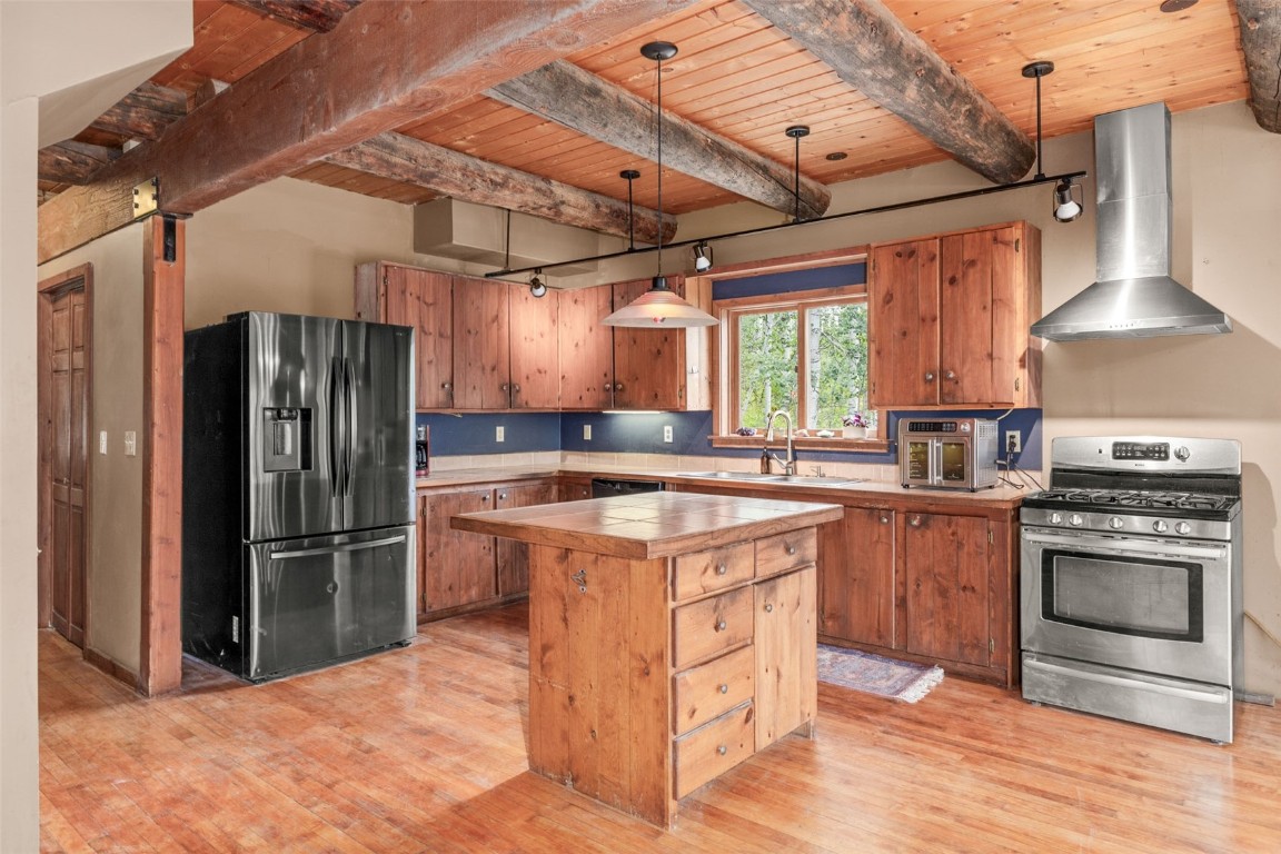 25065 Aspen Way Clark, CO 80428 - Photo 11 of 50 a kitchen with stainless steel appliances granite countertop a stove a refrigerator and a sink