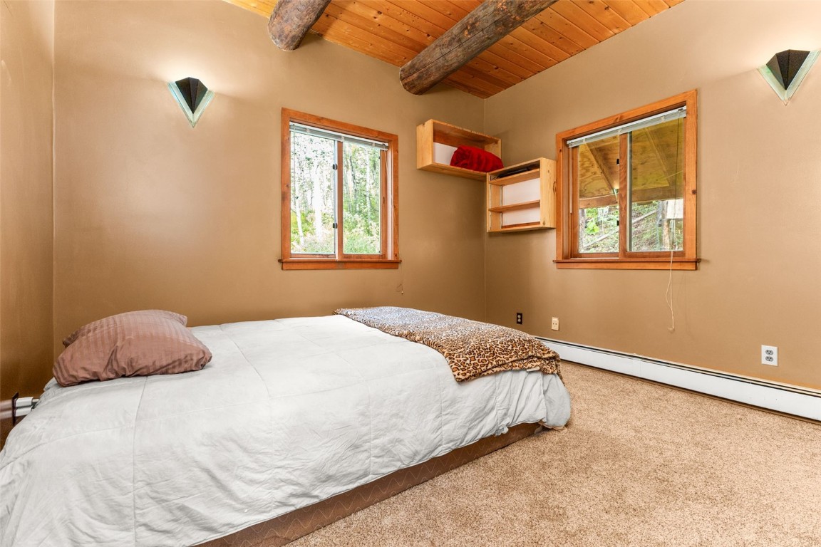 25065 Aspen Way Clark, CO 80428 - Photo 12 of 50 a bedroom with a bed and a window