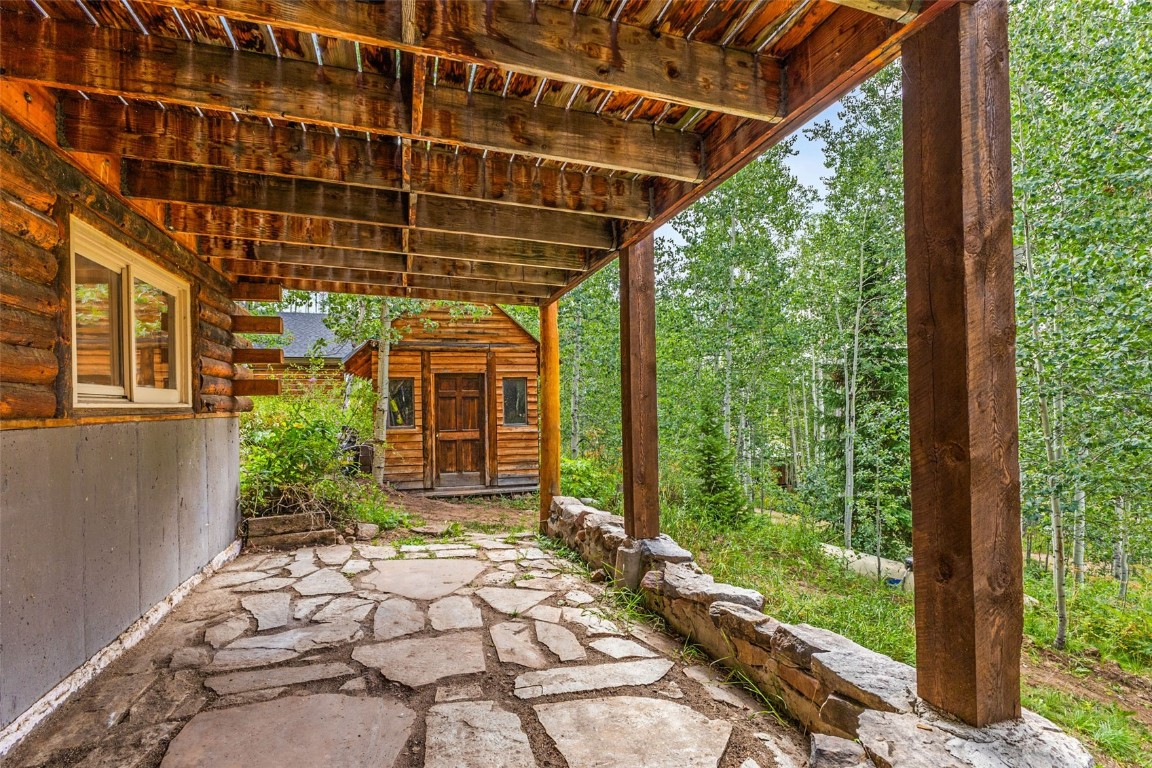 25065 Aspen Way Clark, CO 80428 - Photo 21 of 50 a view of a porch with a wooden floor