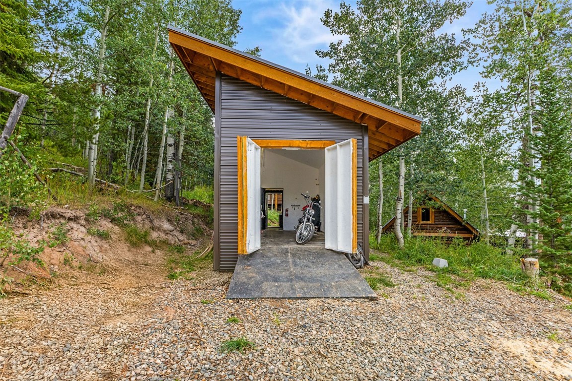 25065 Aspen Way Clark, CO 80428 - Photo 28 of 50 a view of a house with a yard