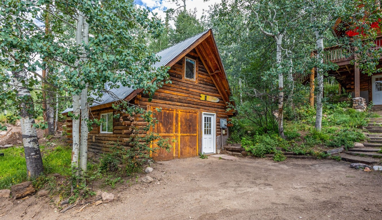 25065 Aspen Way Clark, CO 80428 - Photo 33 of 50 a view of a house with a yard and plants