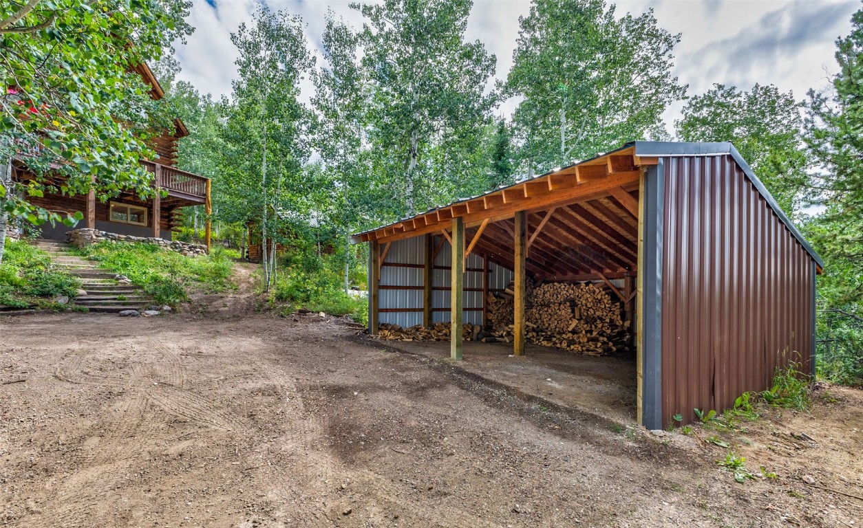 25065 Aspen Way Clark, CO 80428 - Photo 34 of 50 a view of backyard with deck and trees