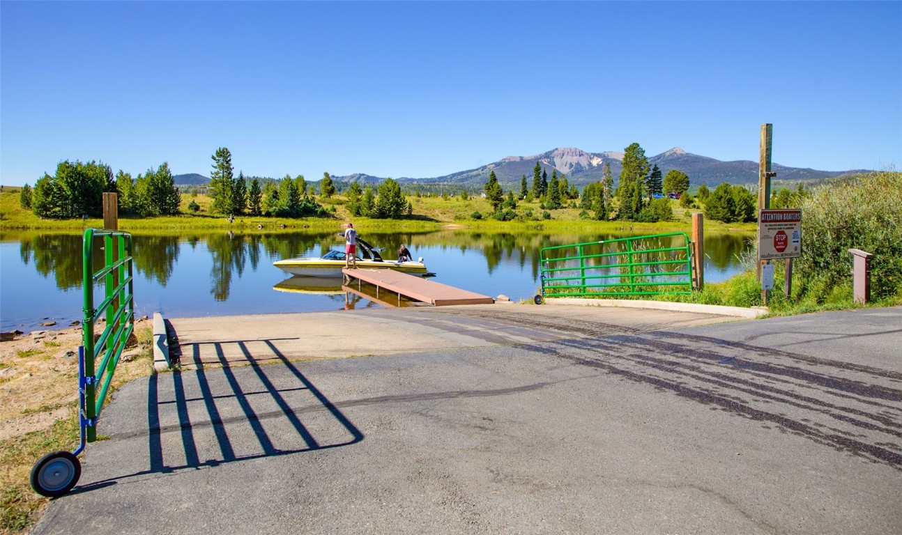 25065 Aspen Way Clark, CO 80428 - Photo 45 of 50 a view of a lake with a table and chairs