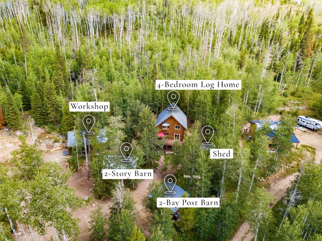 25065 Aspen Way Clark, CO 80428 - Photo 5 of 50 a sign broad in front of red brick house