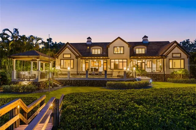 a kitchen with stainless steel appliances granite countertop a sink and a refrigerator