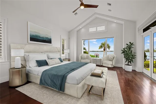 a view of an empty room with a window and cabinet