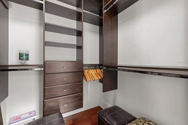 a bedroom with a bed and a television