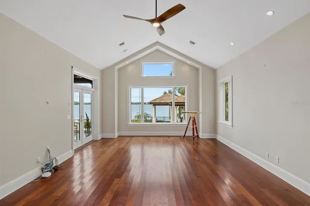 a view of roof deck with couches and wooden floor