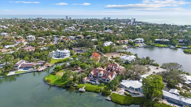 a dining room with furniture a chandelier and window