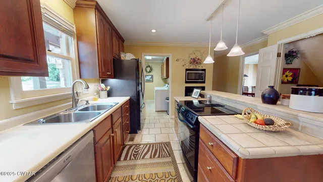 a kitchen with sink stove and cabinets
