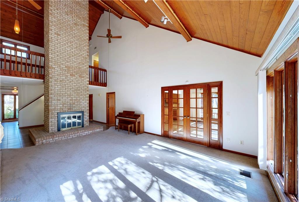 5205 Saddle Brook Road Oak Ridge, NC 27310 - Photo 12 of 50 Gorgeous room w/vaulted wood ceiling.