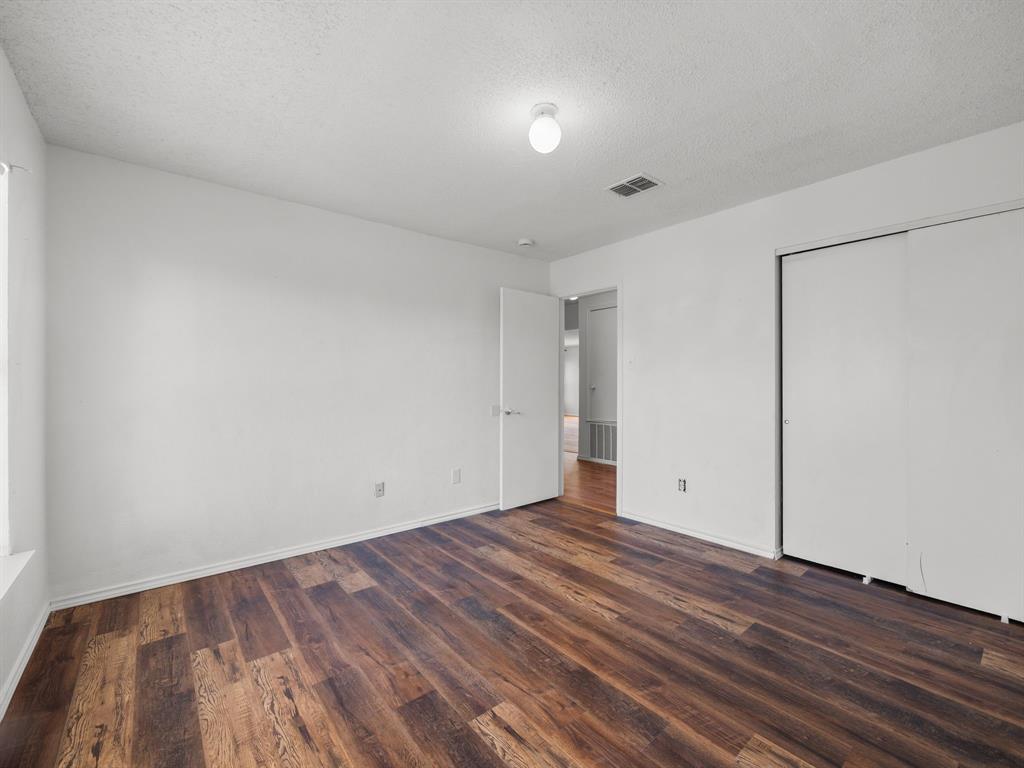 1237 McCary Street Cedar Hill, TX 75104 - Photo 22 of 38 a view of an empty room with wooden floor