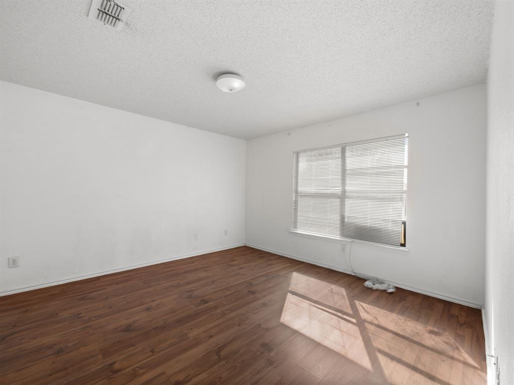 1237 McCary Street Cedar Hill, TX 75104 - Photo 25 of 38 an empty room with wooden floor and windows