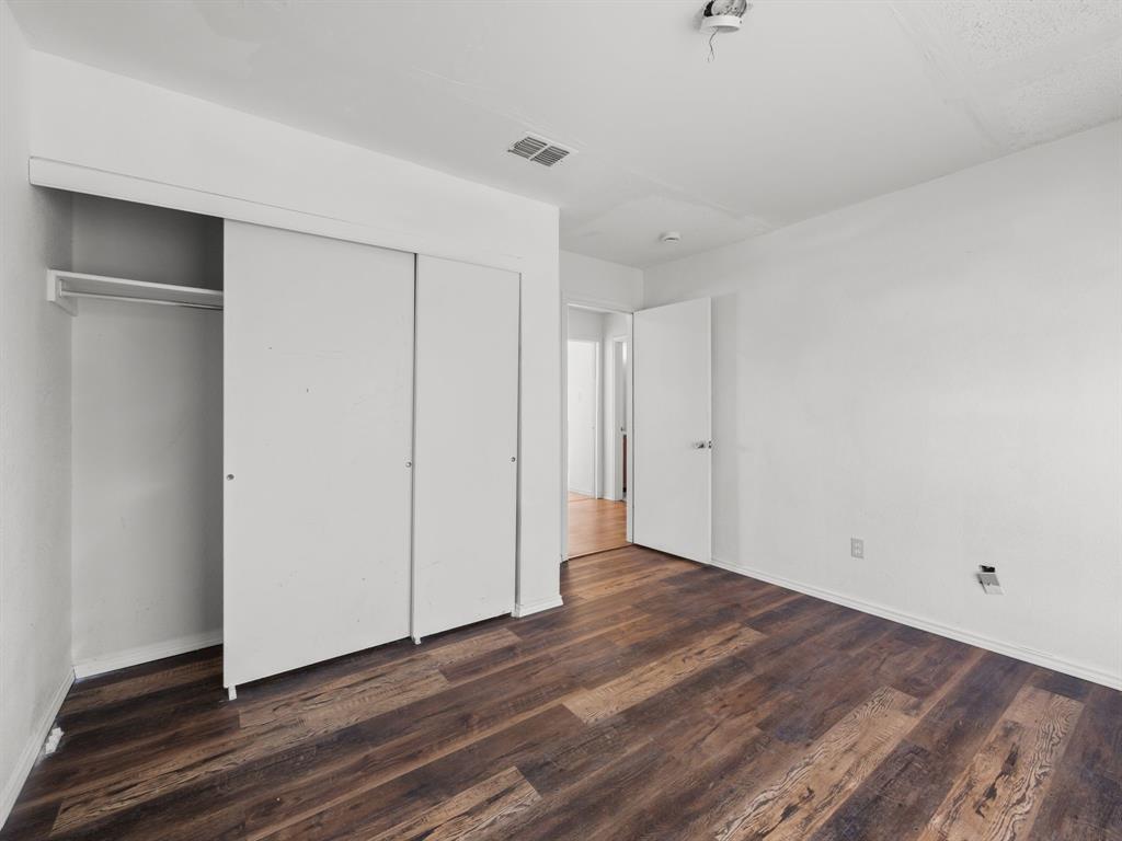 1237 McCary Street Cedar Hill, TX 75104 - Photo 28 of 38 a view of an empty room with wooden floor