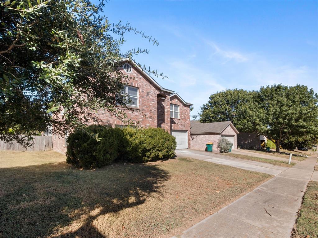 1237 McCary Street Cedar Hill, TX 75104 - Photo 4 of 38 a view of a house with a yard and plant