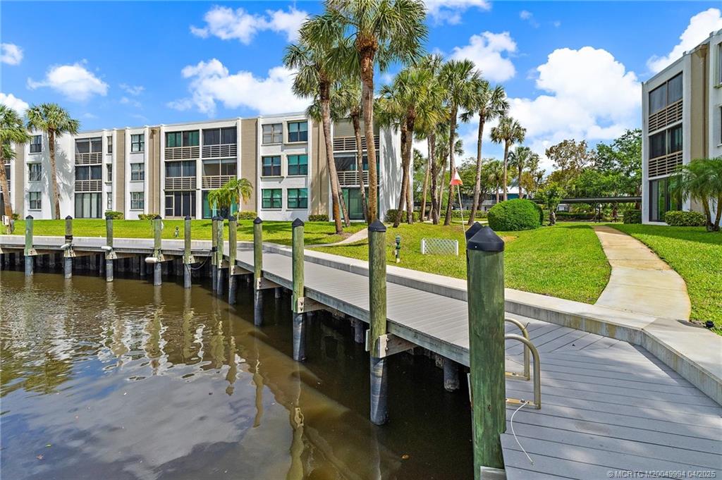 1950 Southwest Palm City Road, Unit 5310 Stuart, FL 34994 - Photo 34 of 72 a view of a swimming pool with a patio