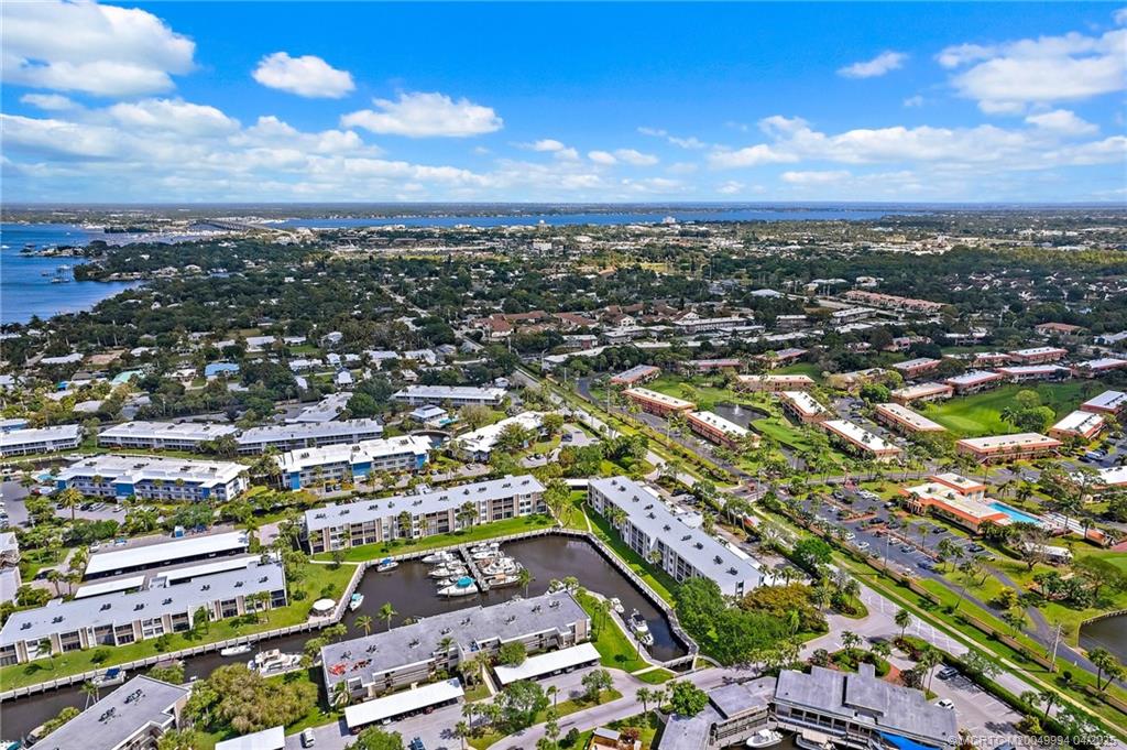 1950 Southwest Palm City Road, Unit 5310 Stuart, FL 34994 - Photo 67 of 72 an aerial view of residential houses with outdoor space