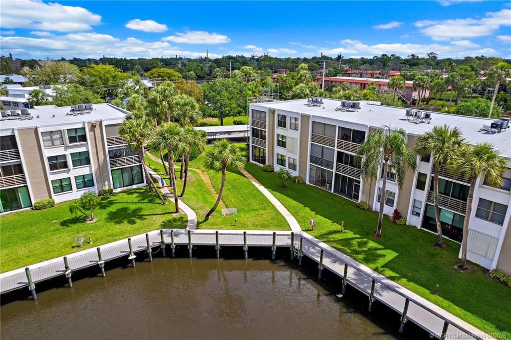 1950 Southwest Palm City Road, Unit 5310 Stuart, FL 34994 - Photo 72 of 72 an aerial view of a house with a swimming pool patio and outdoor seating