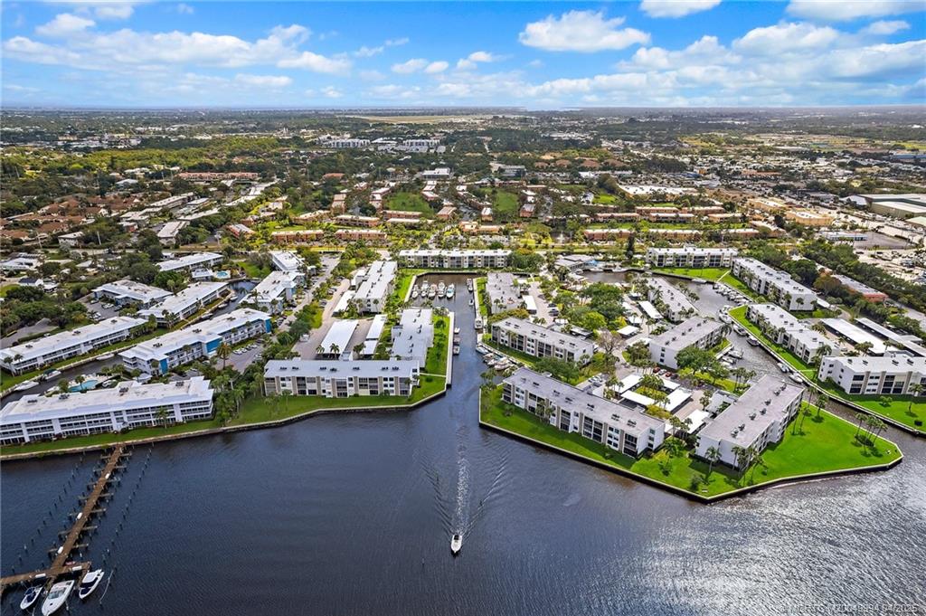 1950 Southwest Palm City Road, Unit 5310 Stuart, FL 34994 - Photo 8 of 72 an aerial view of residential houses with outdoor space
