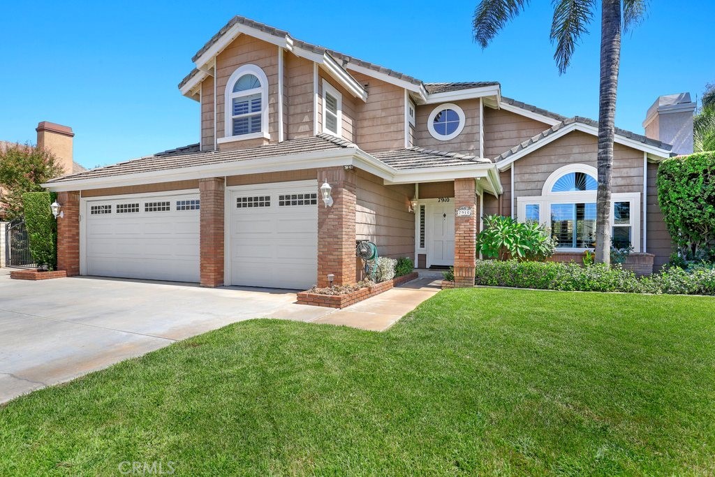 7910 Westgate Court Riverside, CA 92506 - Photo 2 of 61 a front view of a house with a yard and garage