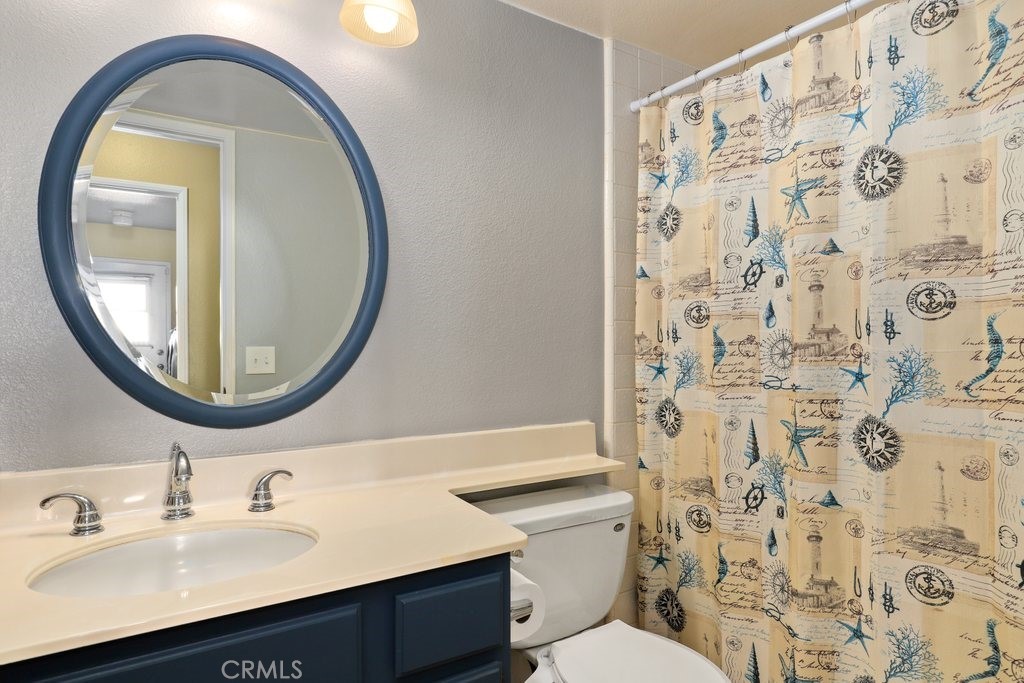 7910 Westgate Court Riverside, CA 92506 - Photo 22 of 61 a bathroom with a sink and a mirror