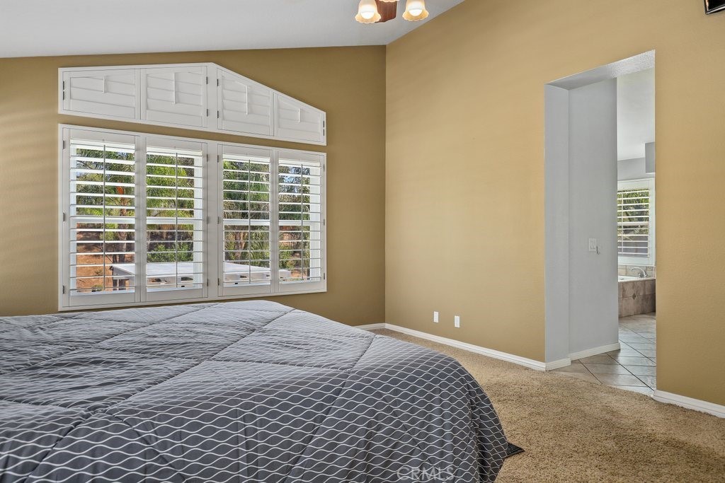 7910 Westgate Court Riverside, CA 92506 - Photo 25 of 61 a bedroom with a bed and a window