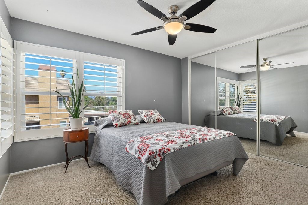 7910 Westgate Court Riverside, CA 92506 - Photo 29 of 61 a bedroom with a bed and a large window