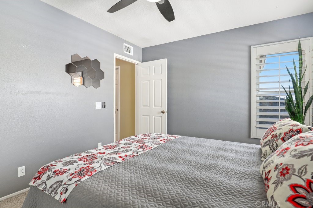 7910 Westgate Court Riverside, CA 92506 - Photo 30 of 61 a bedroom with a bed and a window