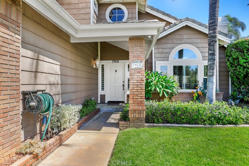 7910 Westgate Court Riverside, CA 92506 - Photo 3 of 61 a view of a house with a small yard plants and a large tree