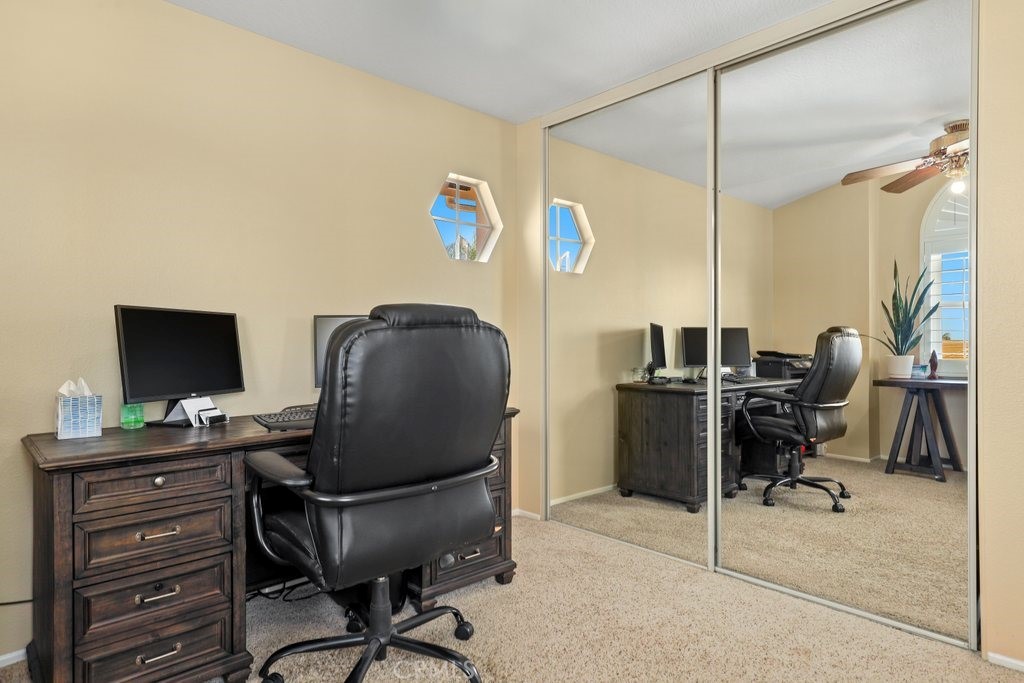 7910 Westgate Court Riverside, CA 92506 - Photo 32 of 61 a work room with furniture and a flat screen tv