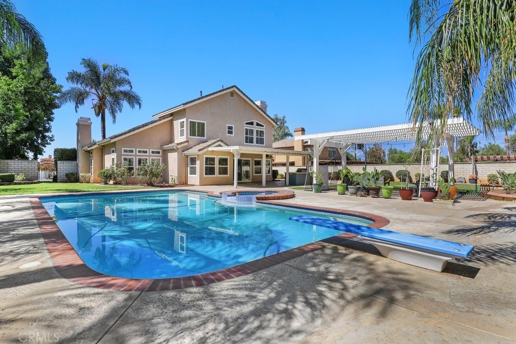 7910 Westgate Court Riverside, CA 92506 - Photo 34 of 61 a view of a house with a swimming pool