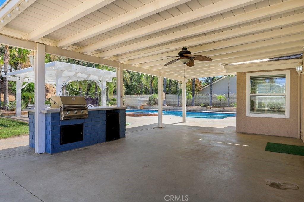 7910 Westgate Court Riverside, CA 92506 - Photo 38 of 61 a living room with stainless steel appliances granite countertop furniture and a large window