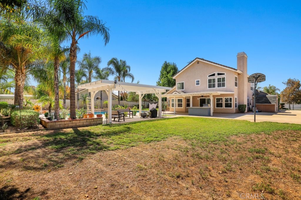 7910 Westgate Court Riverside, CA 92506 - Photo 42 of 61 a front view of a house with a yard table and chairs