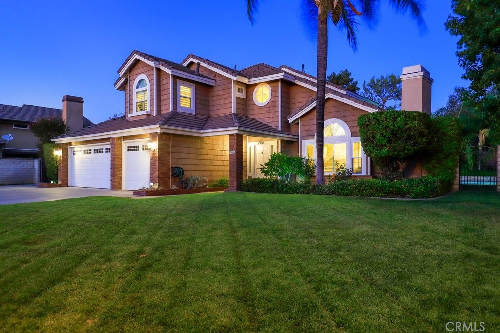 7910 Westgate Court Riverside, CA 92506 - Photo 51 of 61 a front view of a house with a yard and trees