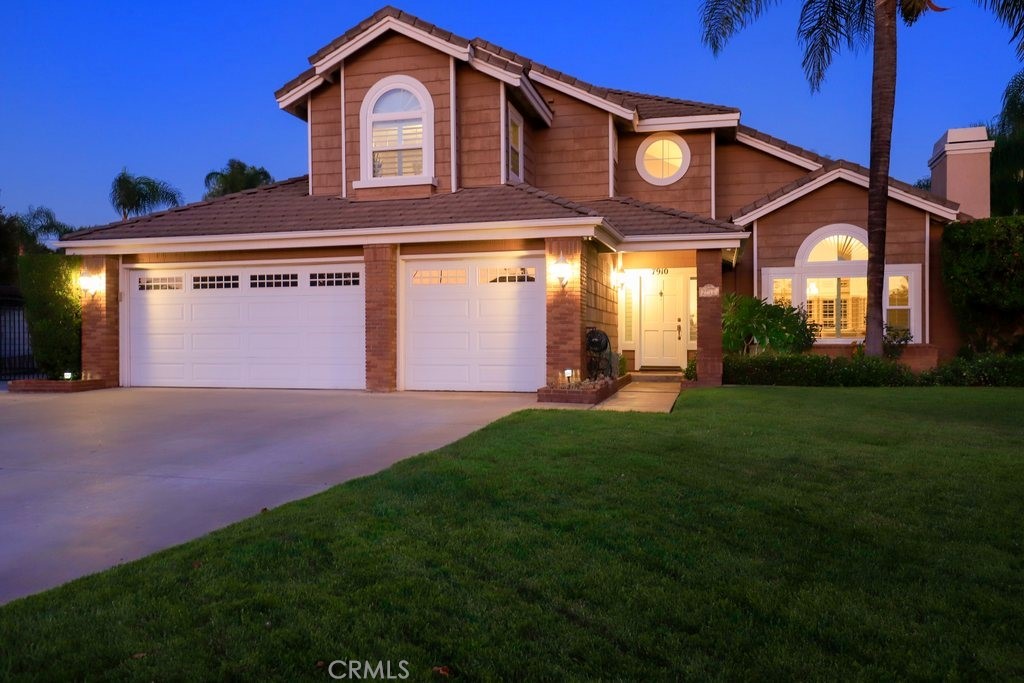 7910 Westgate Court Riverside, CA 92506 - Photo 52 of 61 a front view of a house with a yard and garage