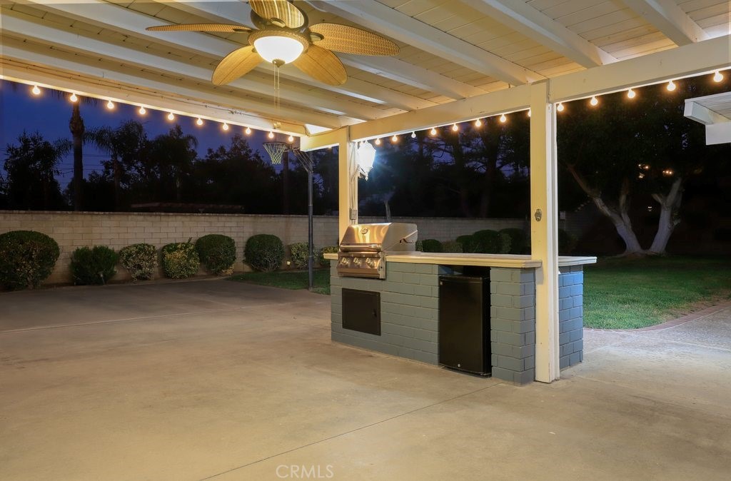 7910 Westgate Court Riverside, CA 92506 - Photo 57 of 61 a view of a patio with table and chairs with a garden