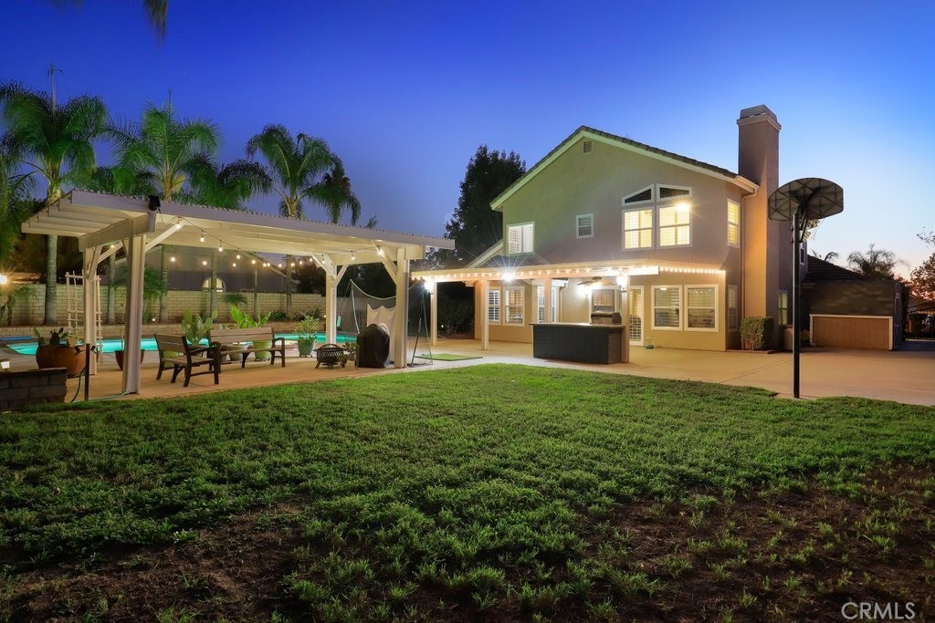 7910 Westgate Court Riverside, CA 92506 - Photo 60 of 61 a front view of a house with a yard