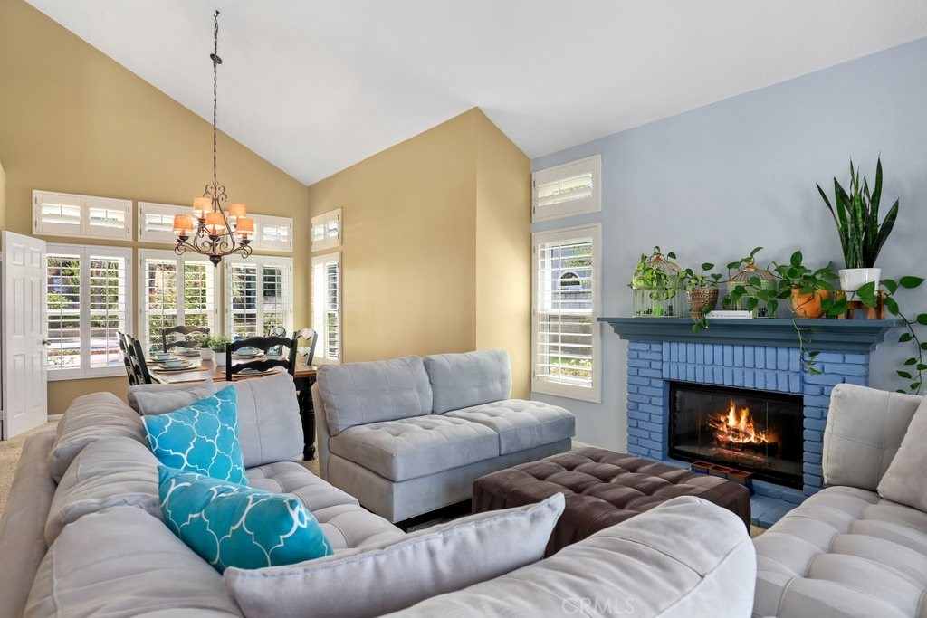 7910 Westgate Court Riverside, CA 92506 - Photo 6 of 61 a living room with furniture and a fireplace