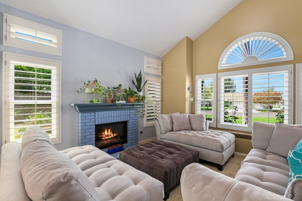 7910 Westgate Court Riverside, CA 92506 - Photo 7 of 61 a living room with furniture windows and a fireplace