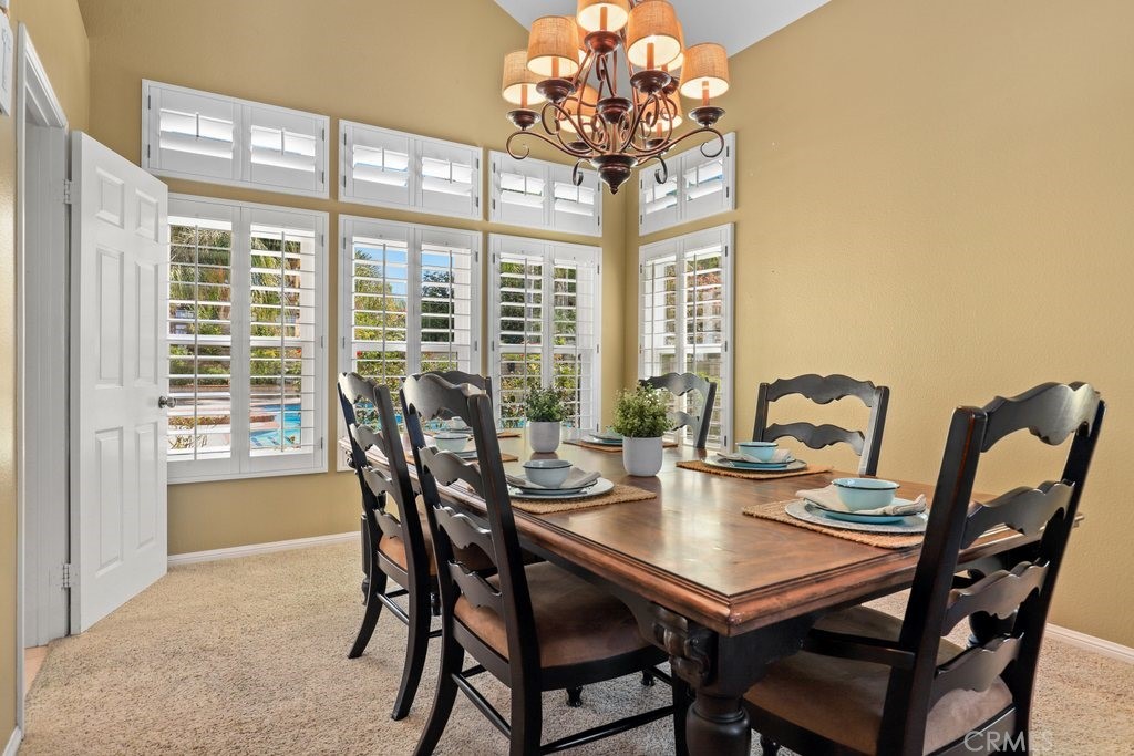 7910 Westgate Court Riverside, CA 92506 - Photo 9 of 61 a view of a dining room with furniture window and outside view