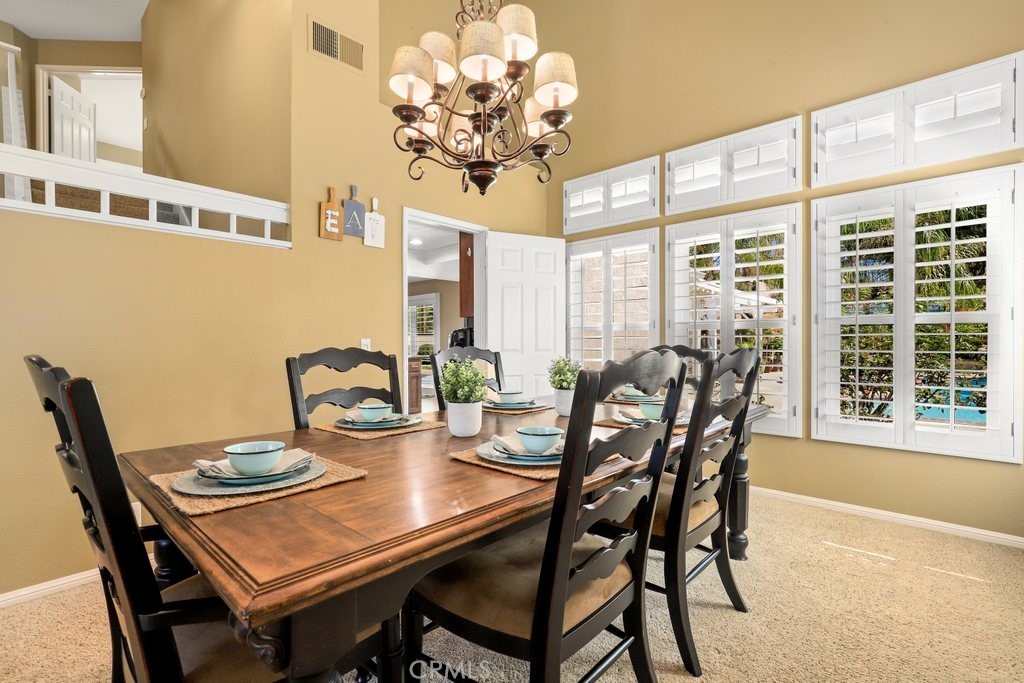 7910 Westgate Court Riverside, CA 92506 - Photo 10 of 61 a view of a dining room with furniture window and outside view