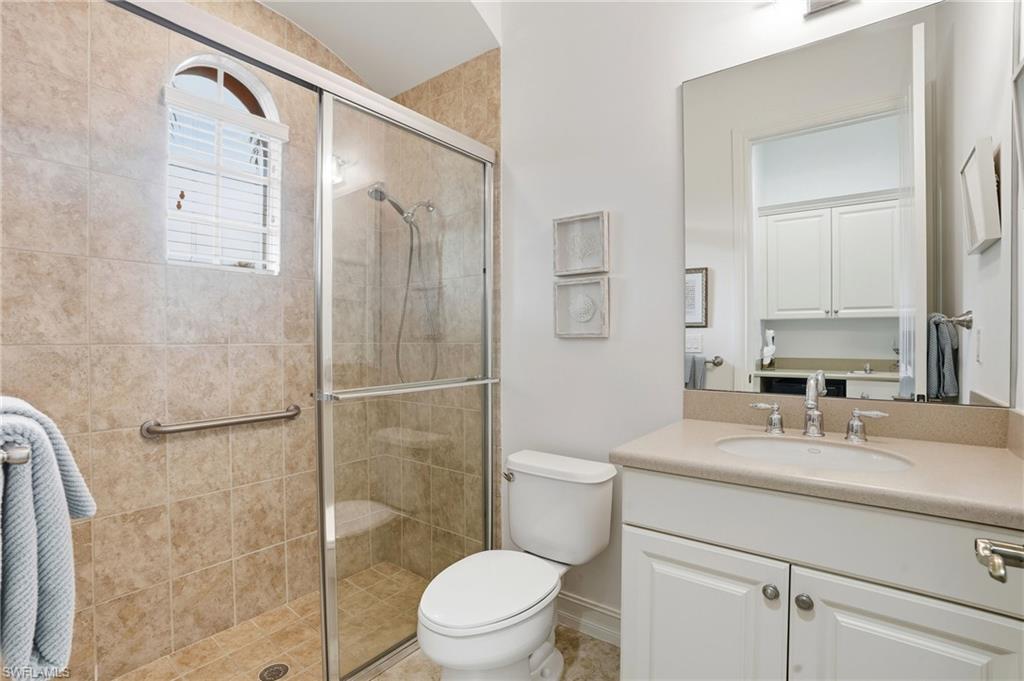 7840 Valencia Court Naples, FL 34113 - Photo 15 of 24 Full bath featuring a shower stall and vanity